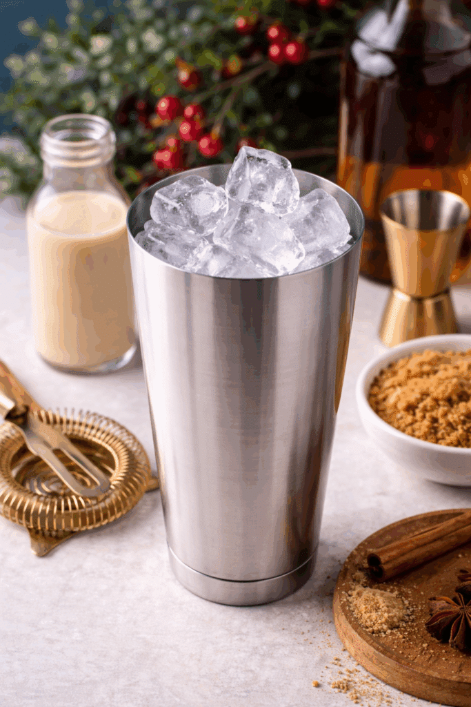 cocktail shaker with ice cubes.