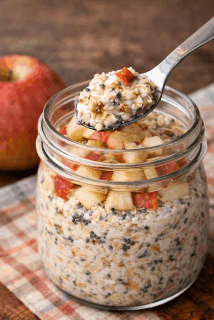 Apple Cinnamon Overnight Oats with Chia & Honey with spoon