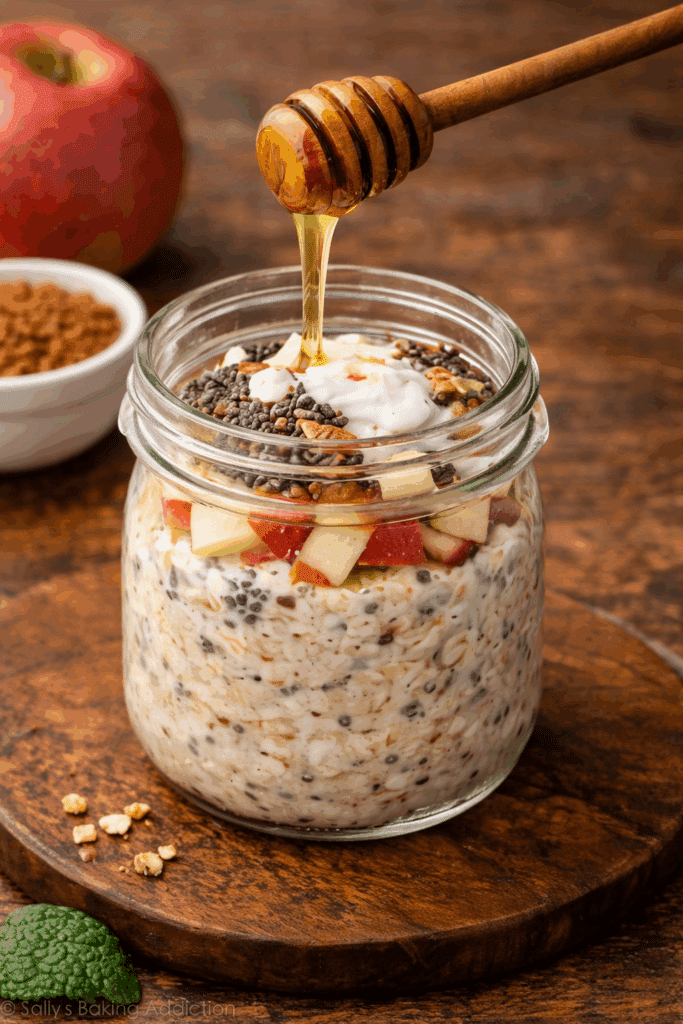 Apple Cinnamon Overnight Oats with Chia pouring honey