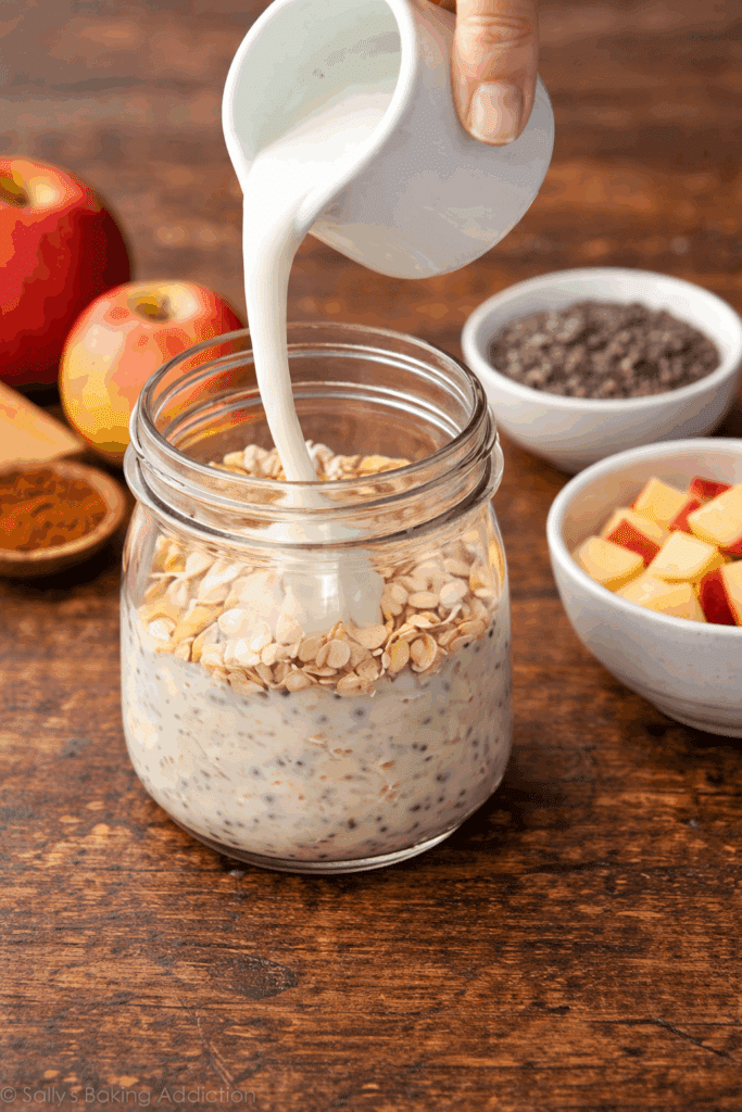 pouring milk in overnight oats