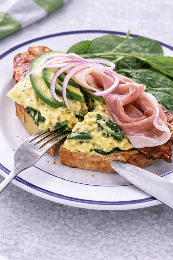 slicing open face breakfast bruschetta