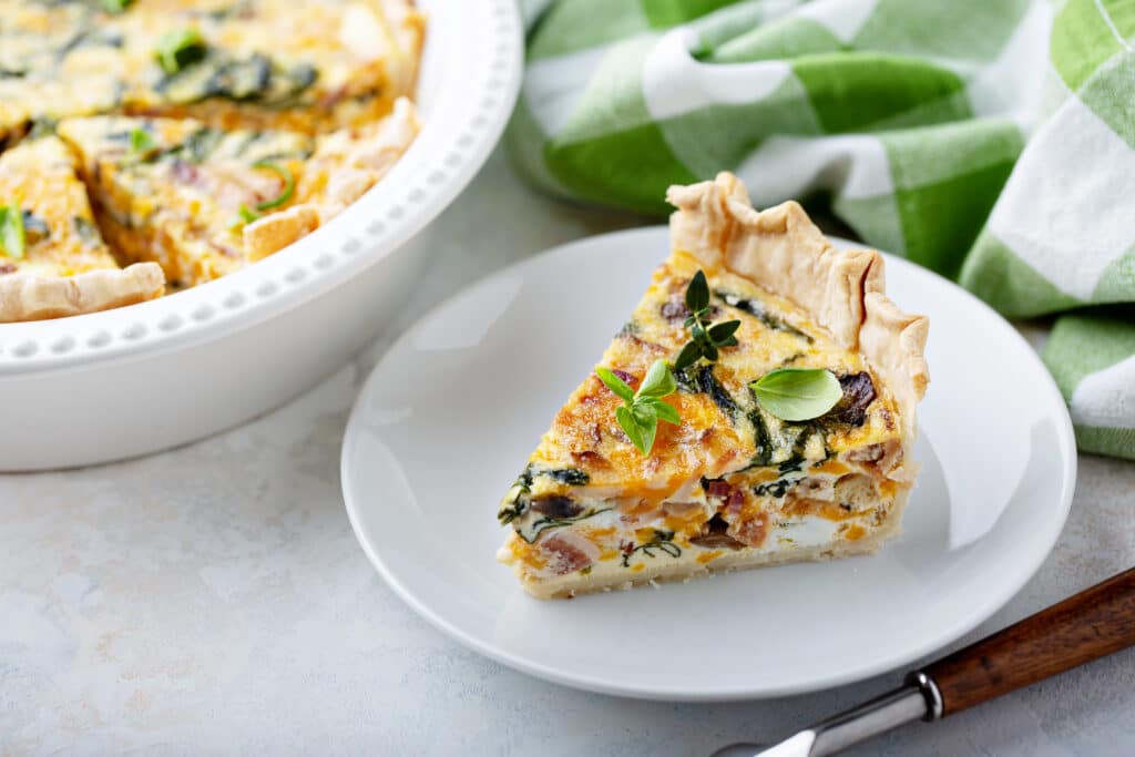 spinach and bacon quiche in a plate