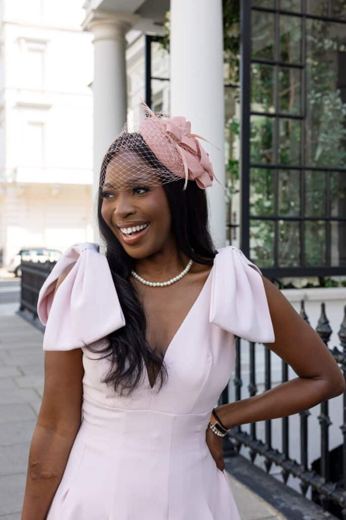 Erica A. Thomas with a pink dress and hat
