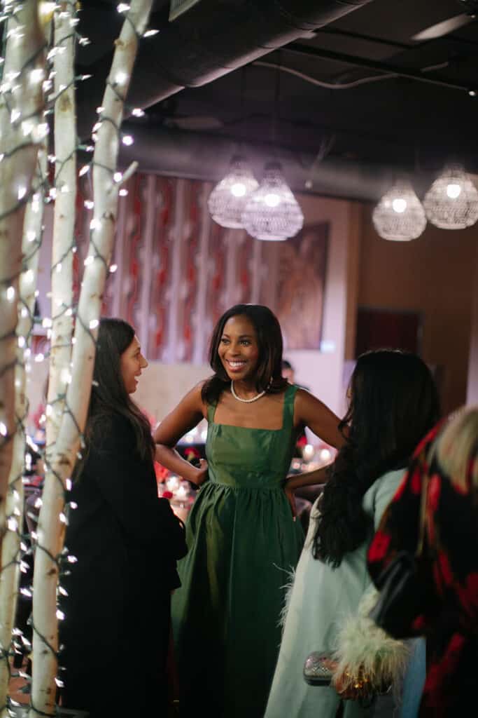 Erica A. Thomas talking with a friend