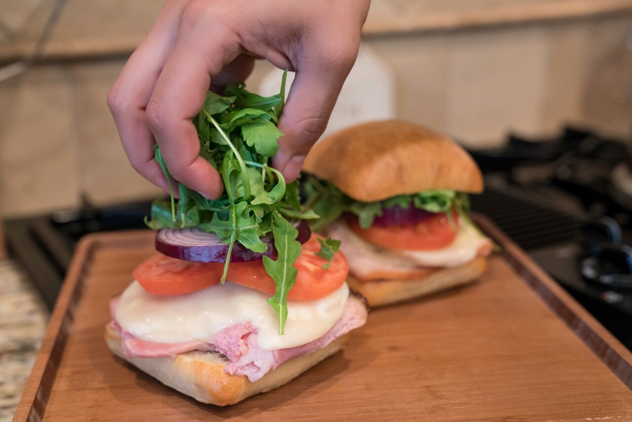 hot ham and provolone sandwich on toasted bread for lunch image