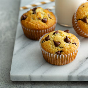 Close-up of chocolate chip muffins on a marble board
