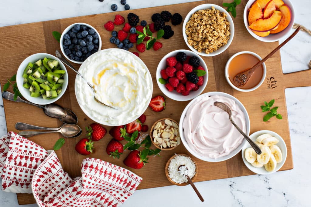 Complete Greek Yogurt Bowls  board serve in wooden platter