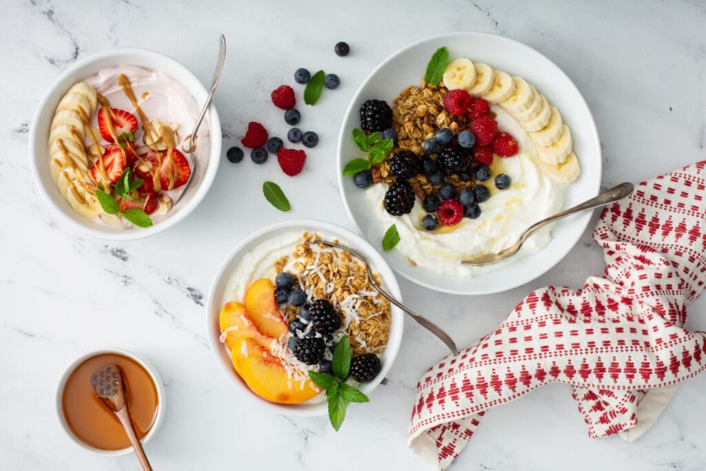Different toppings and combinations of Greek Yogurt Bowls  in server platter 