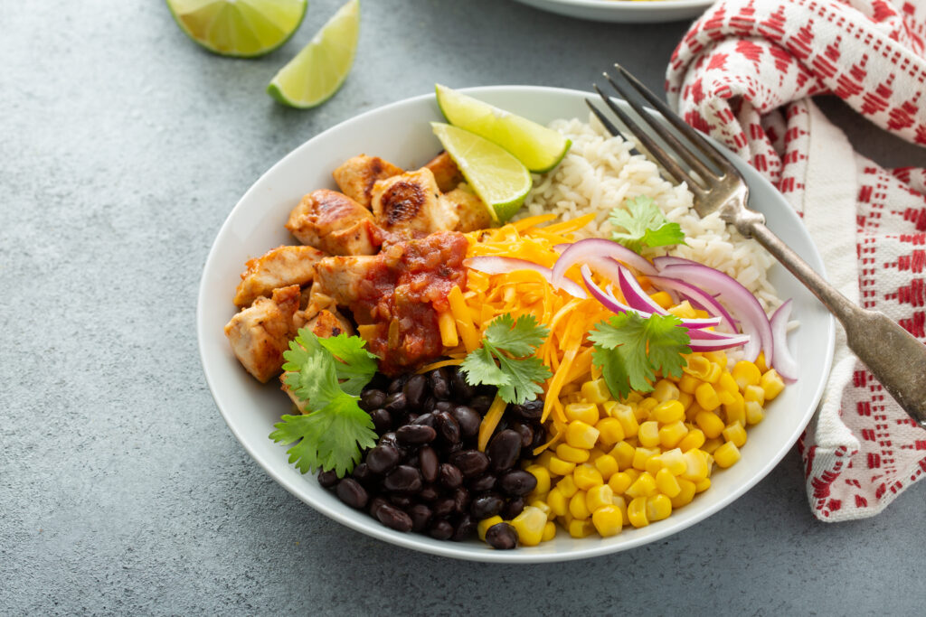 These Easy Spicy Chicken Rice Bowls are the perfect meal to make during the week and pack the next day for leftover. CLICK HERE to see how to make them!