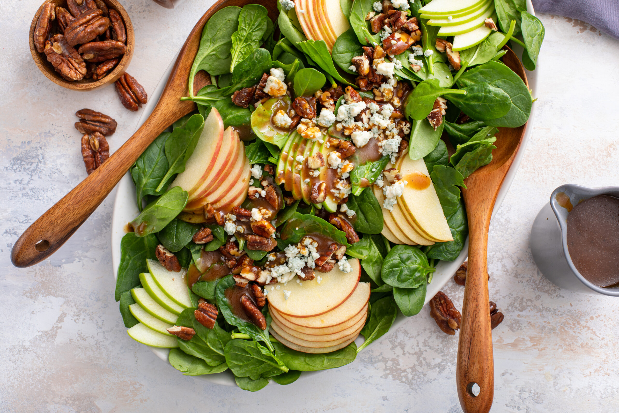 A delicious and hearty winter salad full of nuts, fruit and cheese that is perfect for an appetizer or add a bit of protein and make it a meal. CLICK here to make it ASAP!