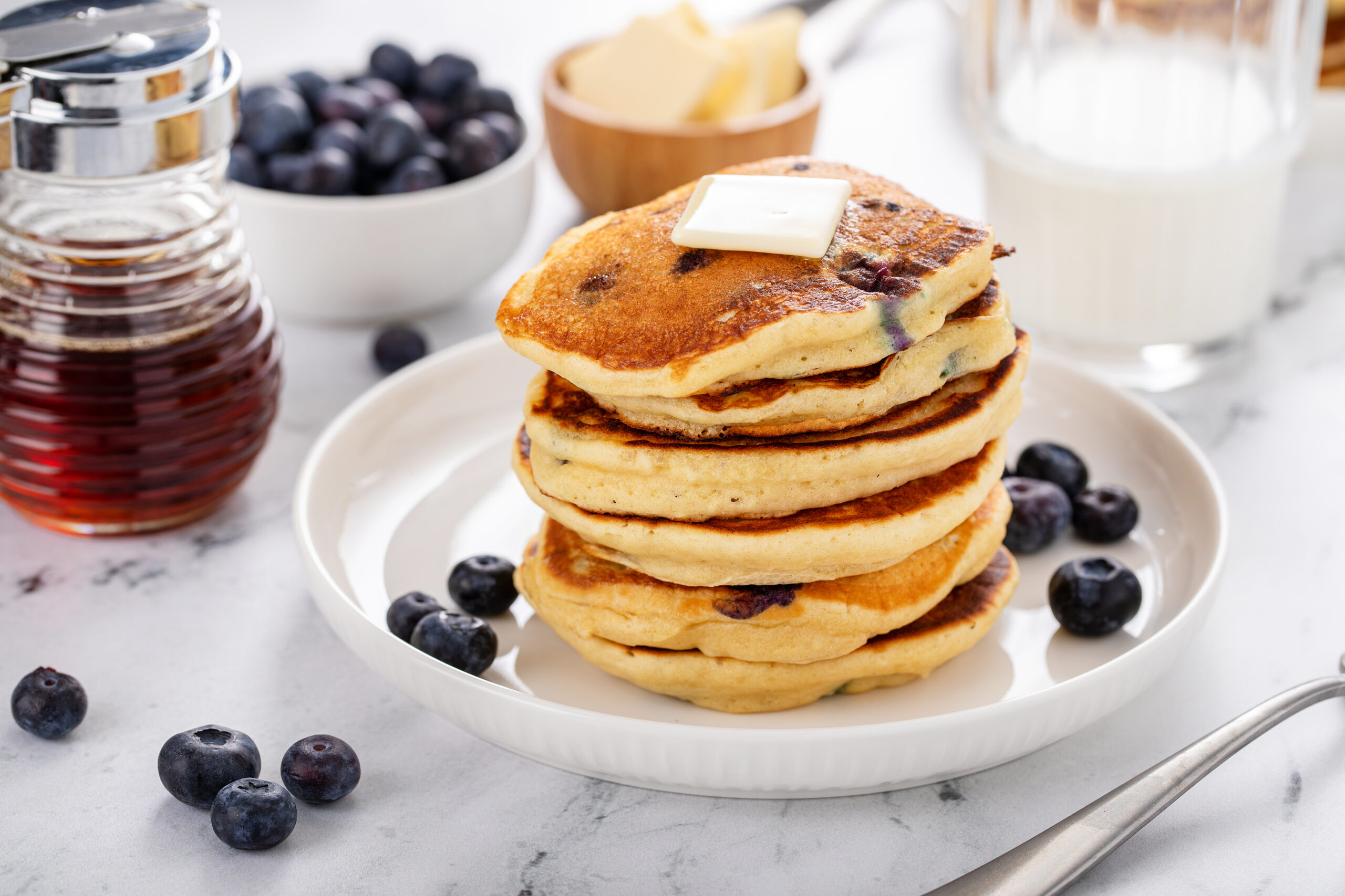 Looking for the BEST blueberry pancake recipe ever? CLICK HERE to try this mouth watering any time breakfast favorite that will be a hit in any household!