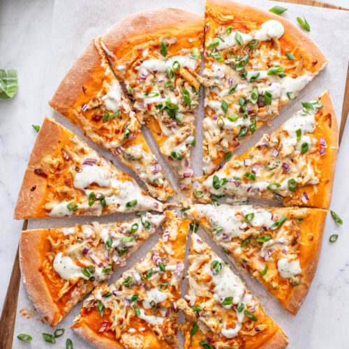 This Buffalo Chicken Pizza is super easy to make with blue cheese or ranch; topped with delicious toppings like buffalo chicken, cilantro, red onions, and more. Trust the whole family will love this recipe!