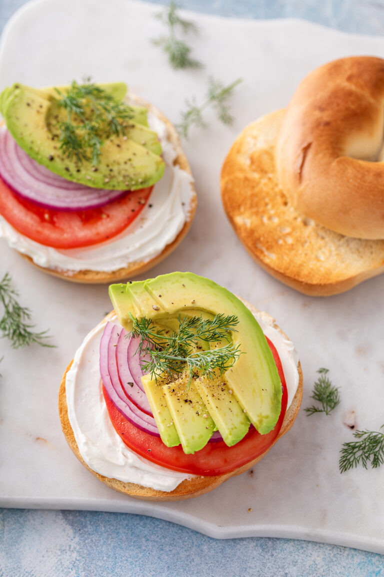 The Perfect Bagel Sandwich: Cream Cheese, Tomato, Red Onion, and Avocado