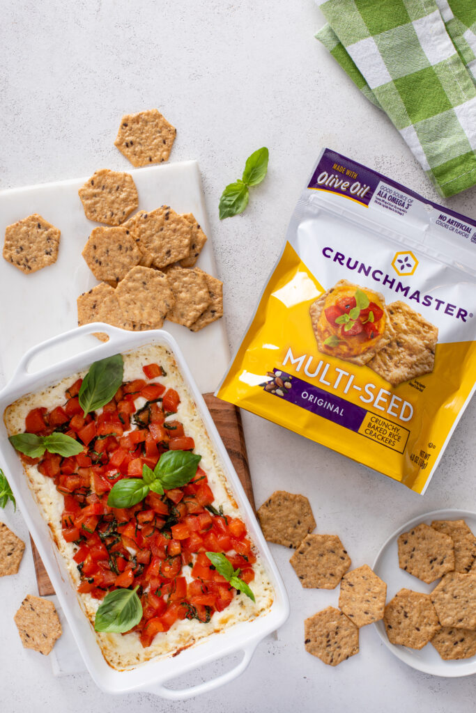 Impress your guests with Baked Goat Cheese Bruschetta Dip with Crackers—a creamy, cheesy dip topped with fresh, tangy tomatoes and served with crispy crackers. Perfect for parties or a flavorful snack!