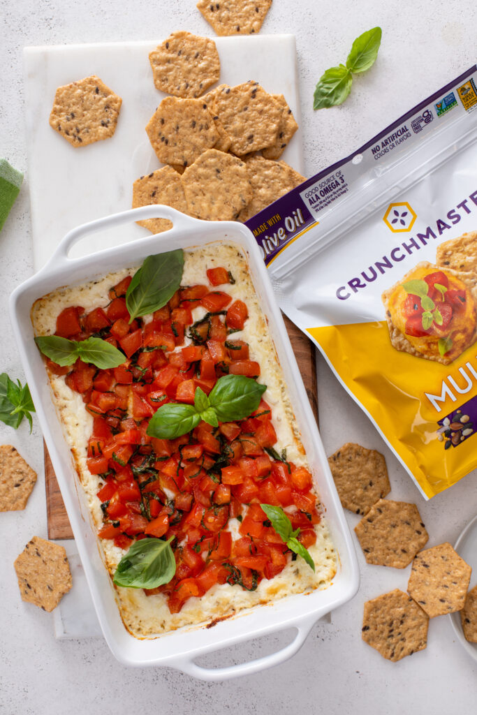 Craving a delicious appetizer? Baked Goat Cheese Bruschetta Dip with Crackers offers a creamy, cheesy bite with tangy tomatoes and crispy crackers—ideal for parties or a savory snack.