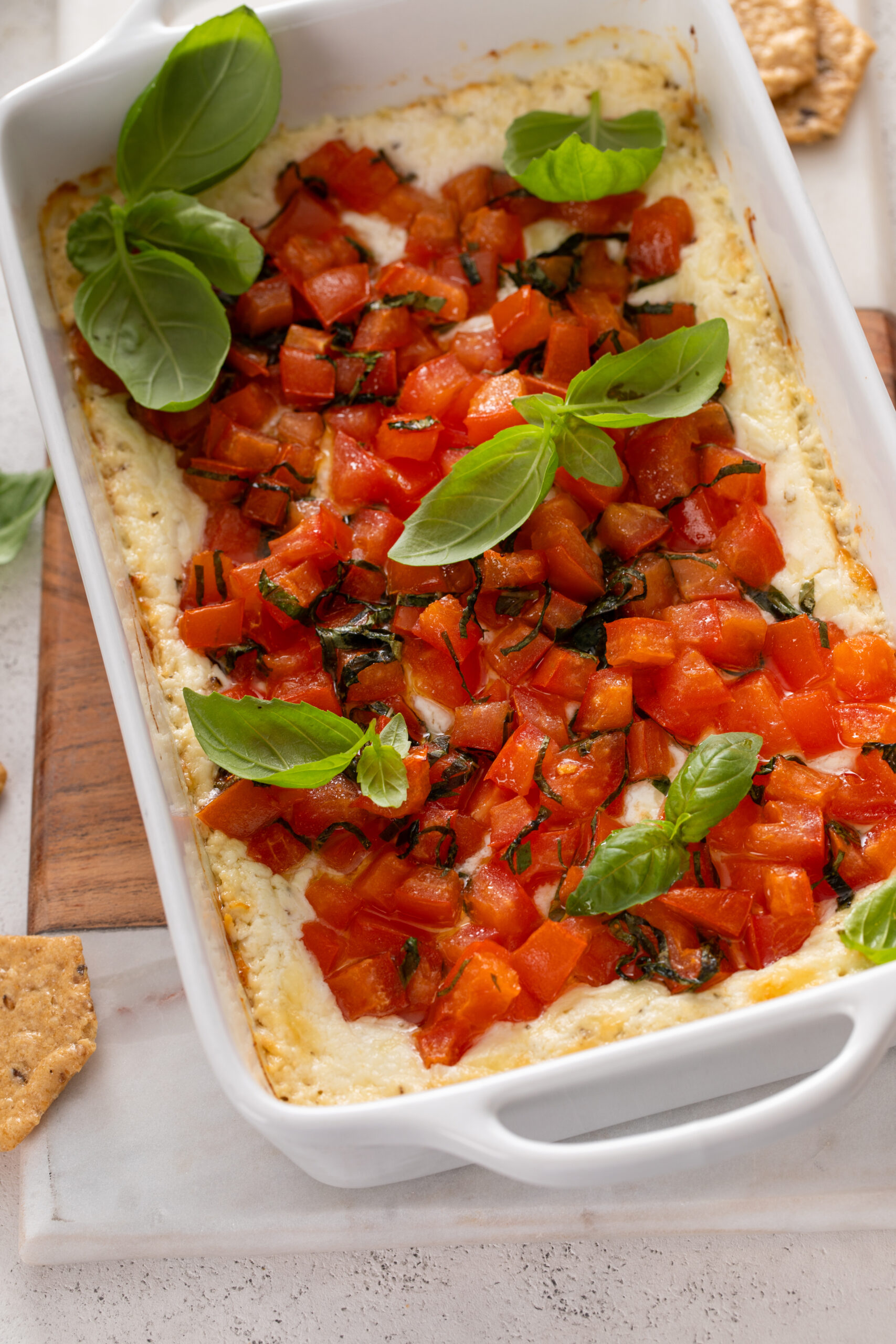 Craving a delicious appetizer? Baked Goat Cheese Bruschetta Dip with Crackers offers a creamy, cheesy bite with tangy tomatoes and crispy crackers—ideal for parties or a savory snack.