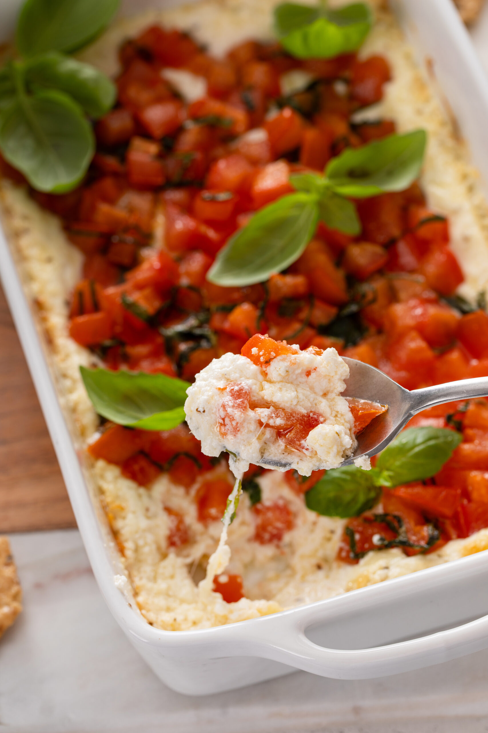 Craving a delicious appetizer? Baked Goat Cheese Bruschetta Dip with Crackers offers a creamy, cheesy bite with tangy tomatoes and crispy crackers—ideal for parties or a savory snack.