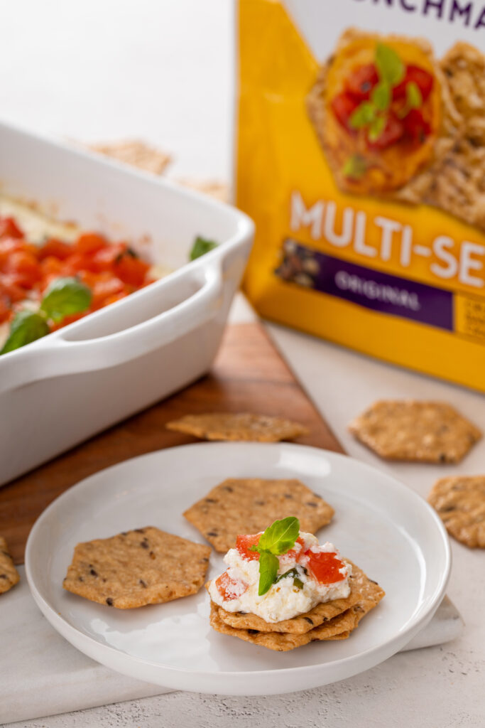 Impress your guests with Baked Goat Cheese Bruschetta Dip with Crackers—a creamy, cheesy dip topped with fresh, tangy tomatoes and served with crispy crackers. Perfect for parties or a flavorful snack!