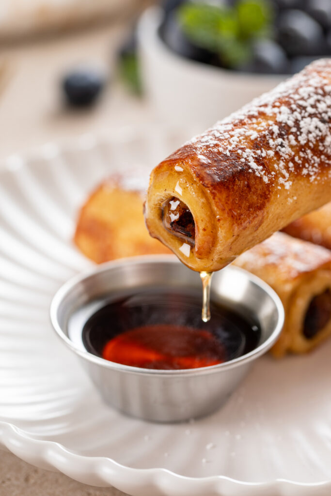 Treat yourself to sausage French toast roll-ups, a mouthwatering breakfast recipe from Atlanta blogger Eating with Erica. Ideal for a special brunch or a cozy morning at home.