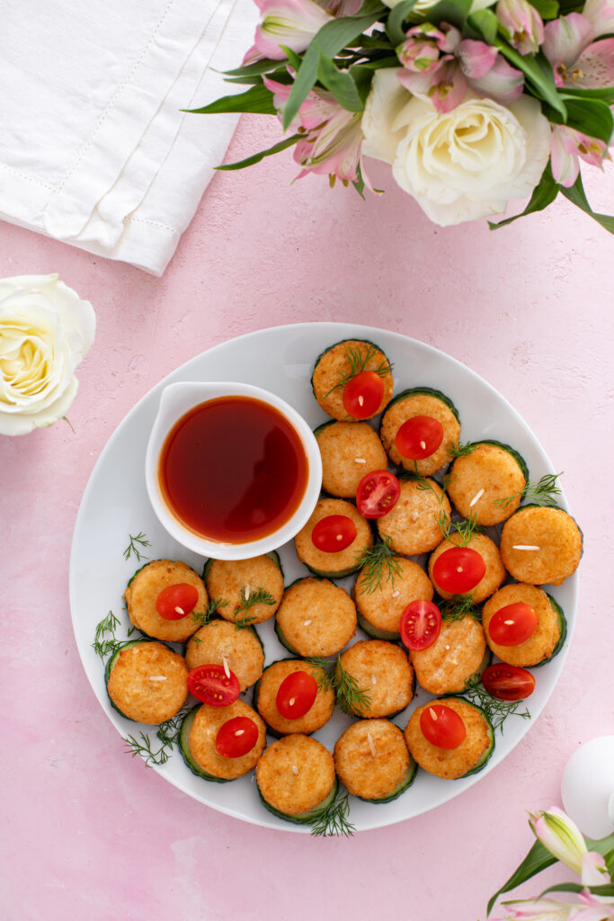 Elevate your next event with Goat Cheese Ball on Cucumber Slice. Creamy goat cheese balls on fresh cucumber rounds, topped with mini tomatoes and dill—perfect for elegant appetizers.