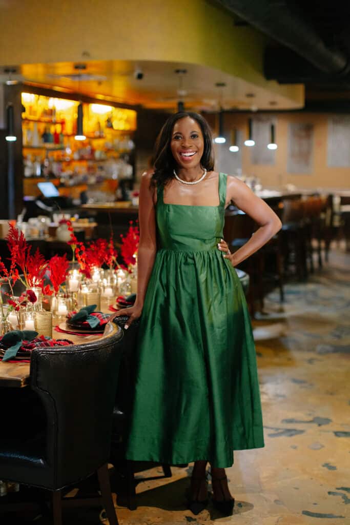 Erica A. Thomas wearing green in her holiday dinner
