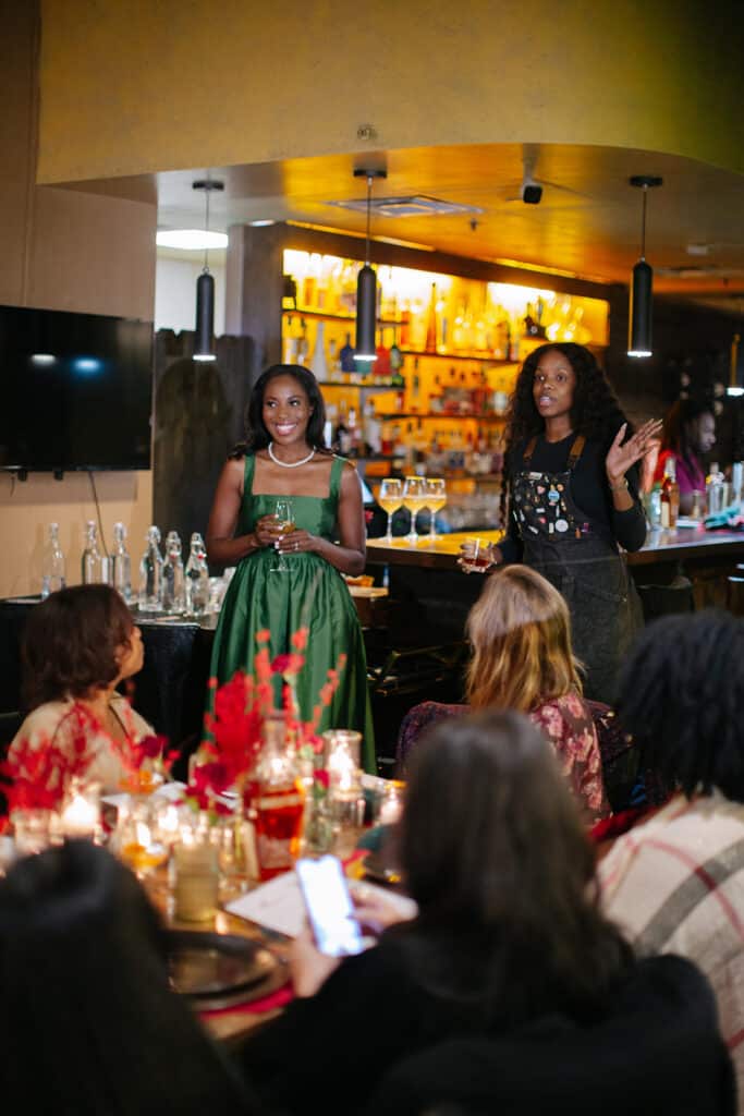 Erica-A.-Thomas-speech-with-a-waiter