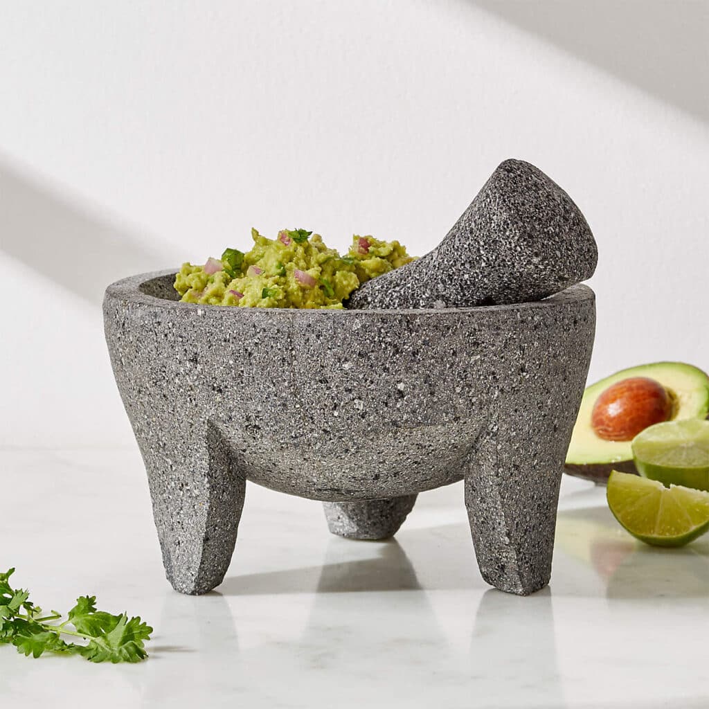 Mortar and pestle with fresh herbs
