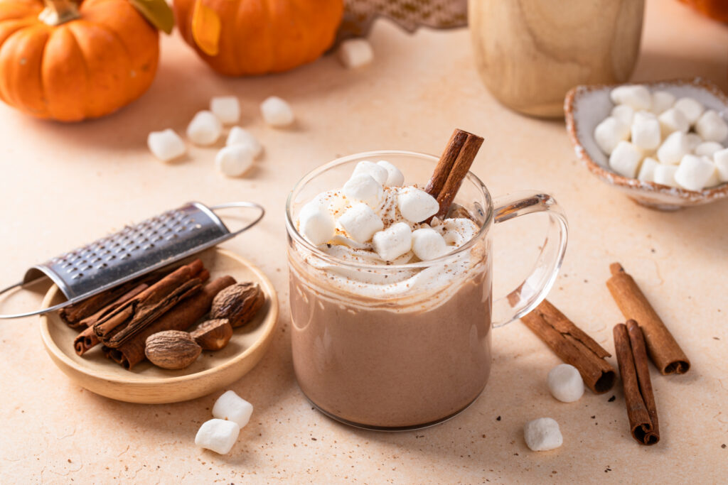 Pumpkin hot chocolate with marshmallows and a sprinkle of nutmeg