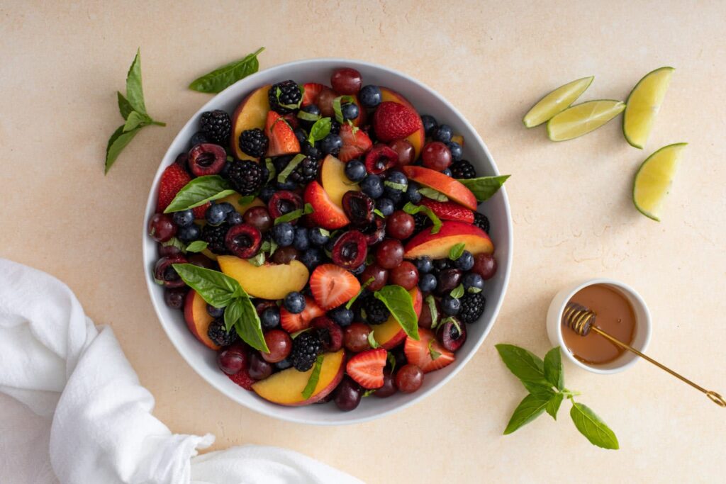 Fruits combined in the bowl Honey Basil Peach Fruit Salad