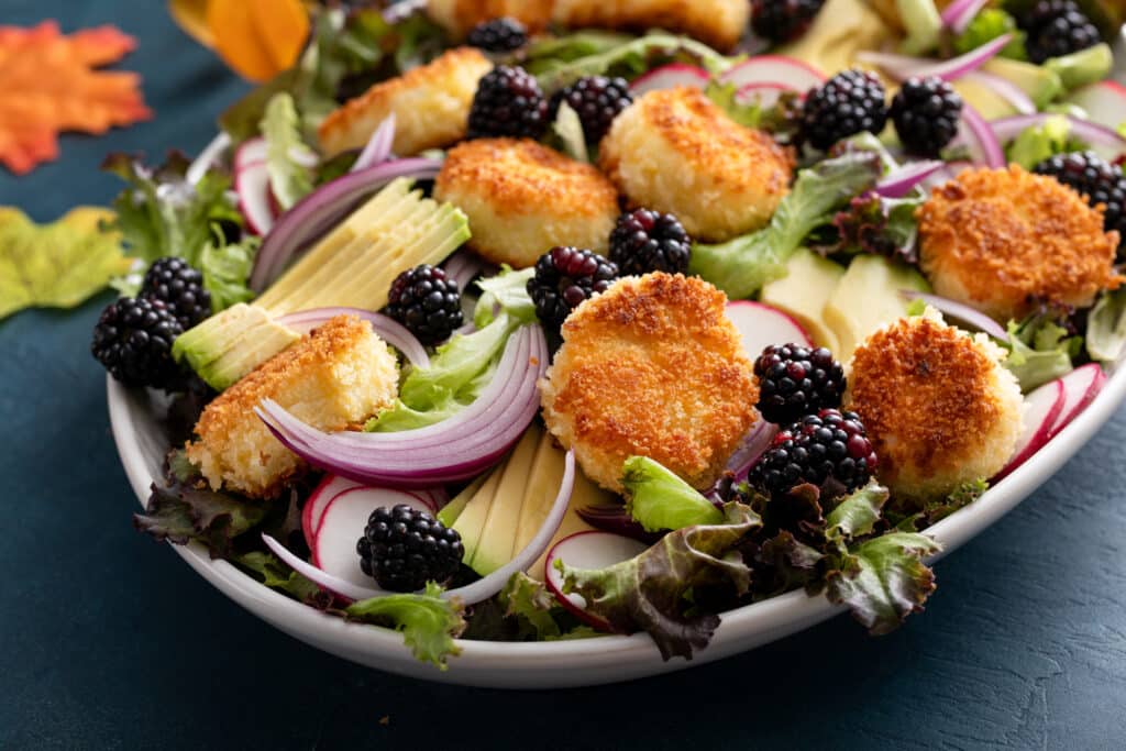 Final look of Blackberry Balsamic Salad with Fried Goat Cheese in serving plate