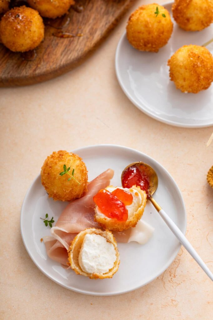 With protein and sauce Perfect Fried Goat Cheese Board