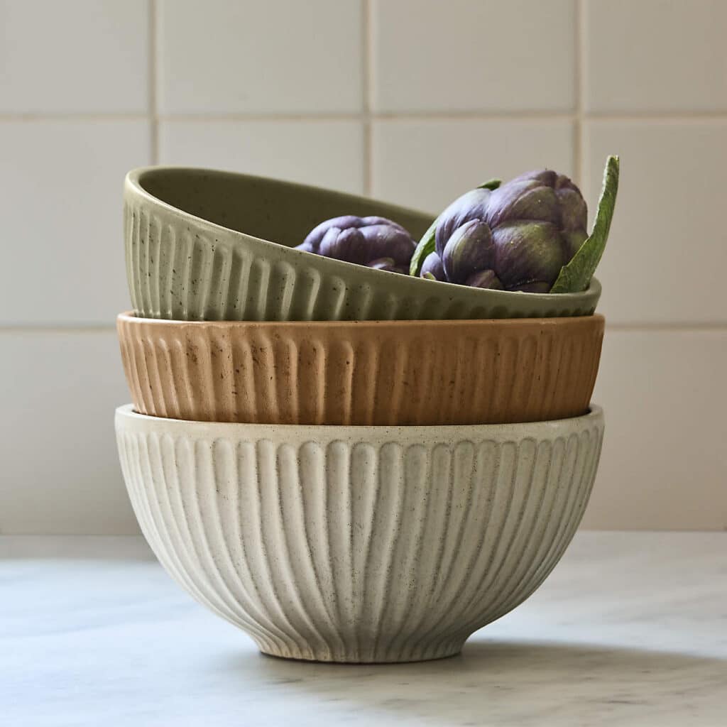 Set of neutral stoneware bowls for plated individual salad servings