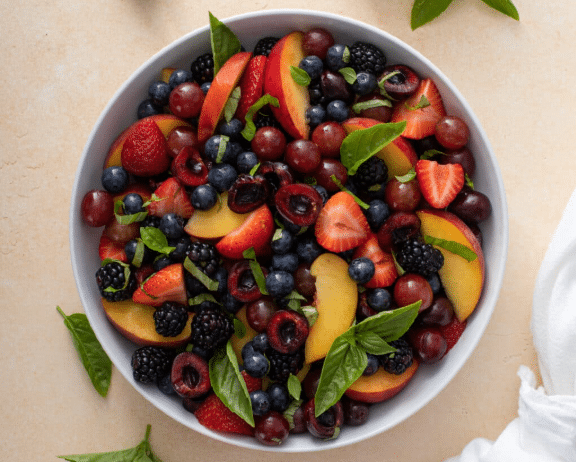 close up and top shot Honey Basil Peach Fruit Salad