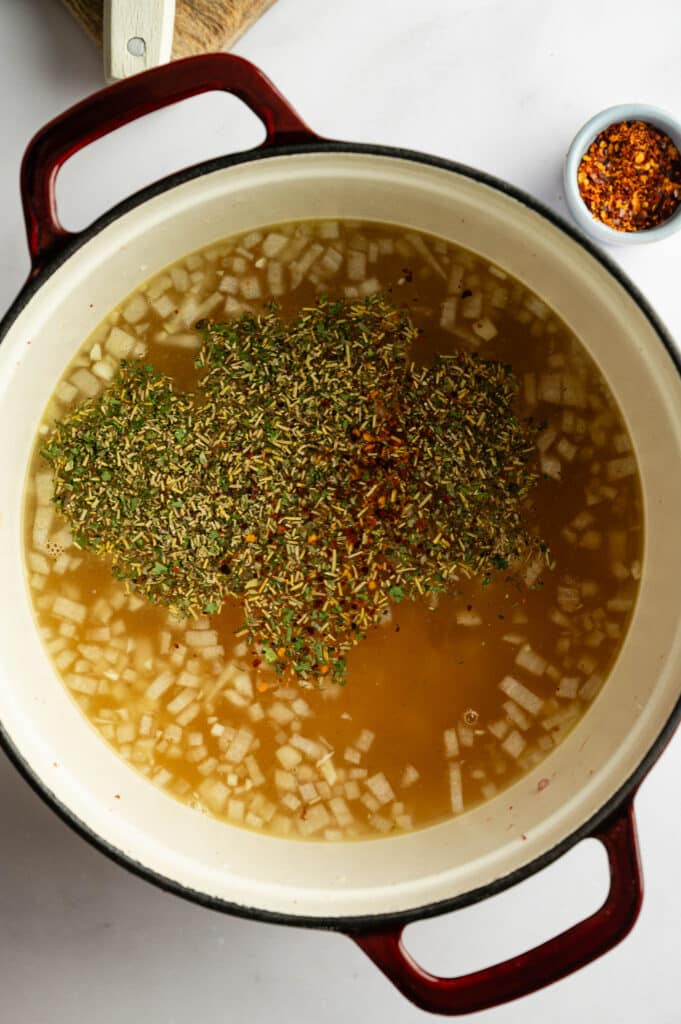 Making the broth of White Sausage tortellini soup
