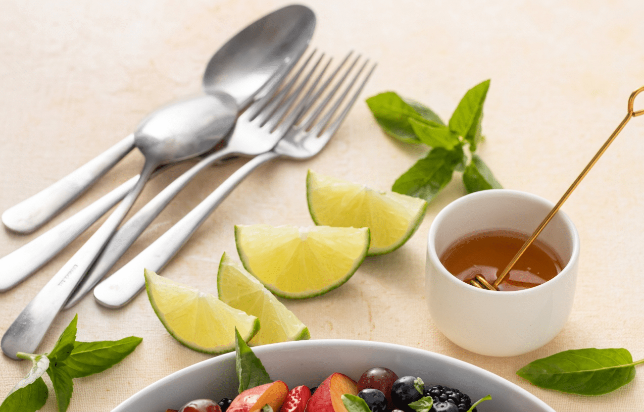 dressing The dressing with lime and utensils Honey Basil Peach Fruit Salad