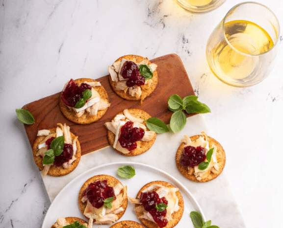 Cranberry Brie Turkey Crackers with bottle of wine 