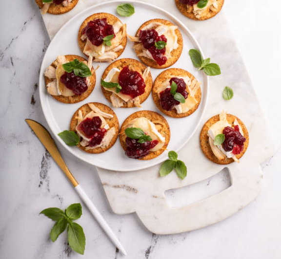 Cranberry Brie Turkey Crackers  on a serving board