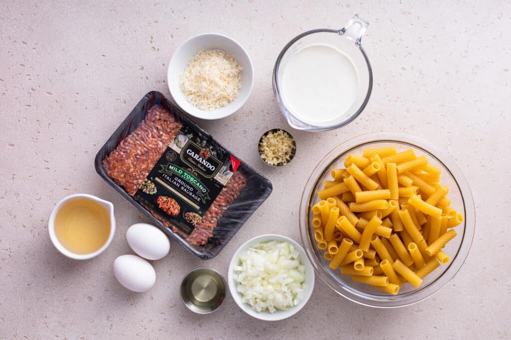 Ingredients for Sausage Rigatoni Pasta flat lay shot
