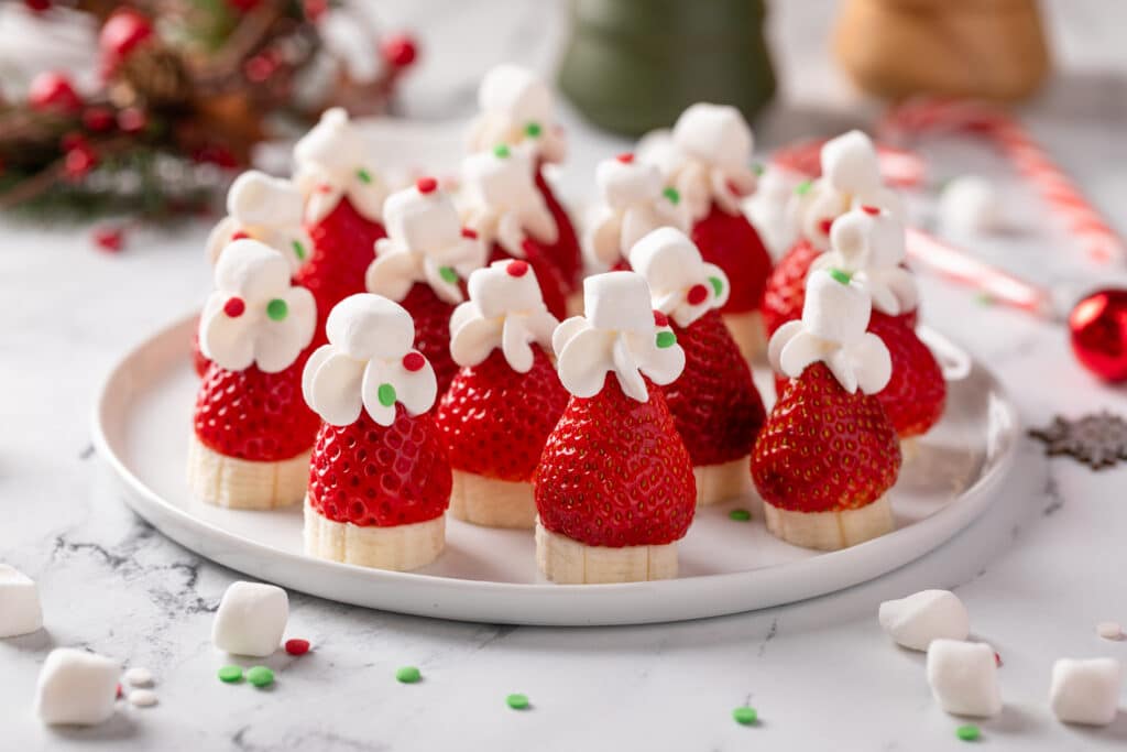 Served in white plate Strawberry Banana Santa Hats