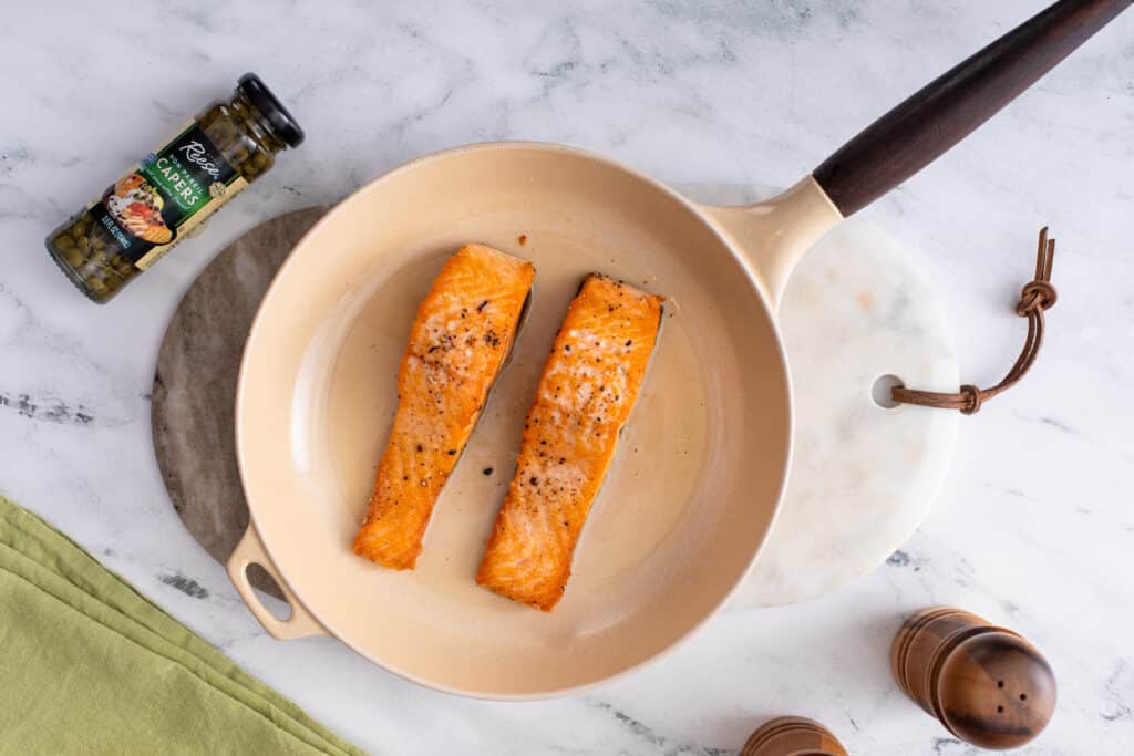 seasoned and sear salmon for Creamy Lemon Salmon Piccata Pasta