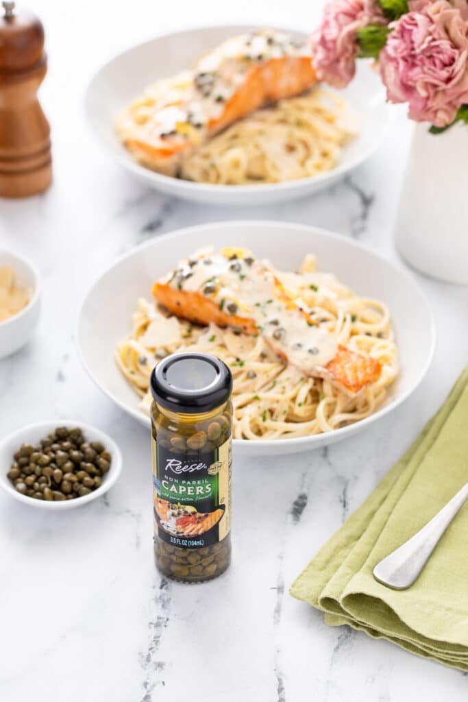 Creamy Lemon Salmon Piccata Pasta shot with capers bottle