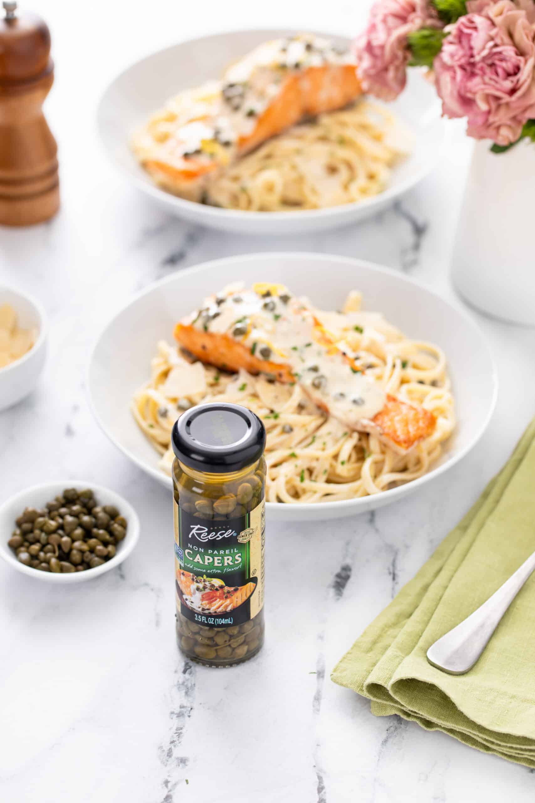 Creamy Lemon Salmon Piccata Pasta shot with capers bottle