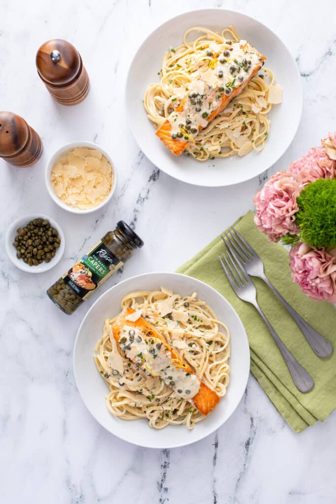 2 servings of Creamy Lemon Salmon Piccata Pasta with capers parmesan