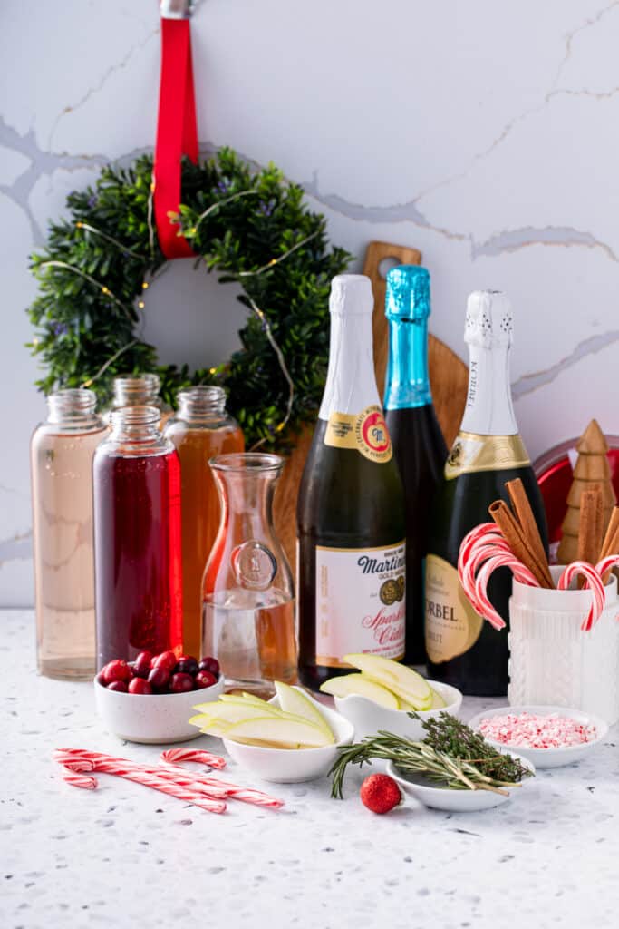 chilled ingredients of holiday mimosa bar recipes shot with garnishes and juces 
