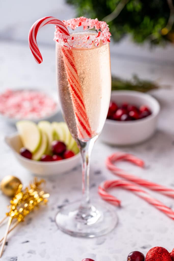 serving of Peppermint Mimosa for Holiday Mimosa Bar with candy cane garnish
