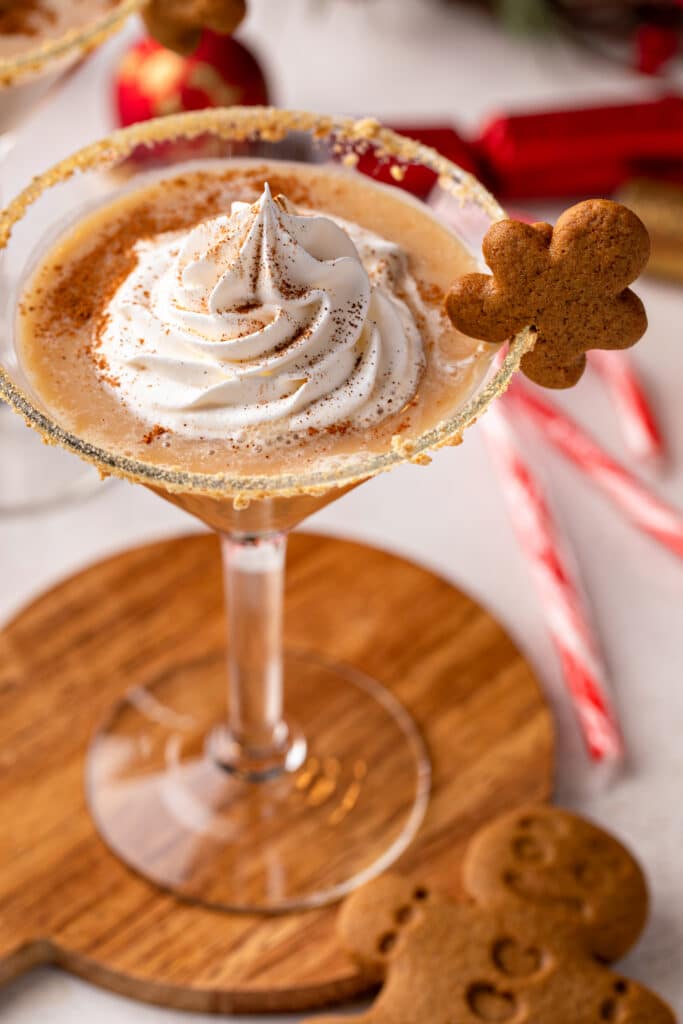 The Perfect Gingerbread Martini served with gingerbread cookie and whipped cream 