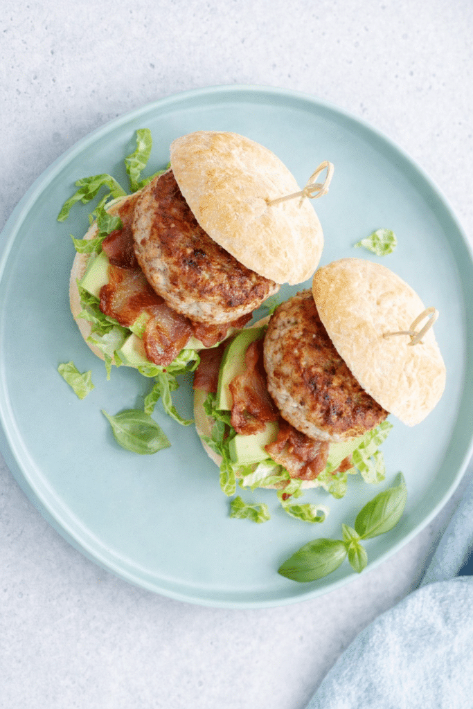 2 of Feta Basil Turkey Burgers served in a serving platter