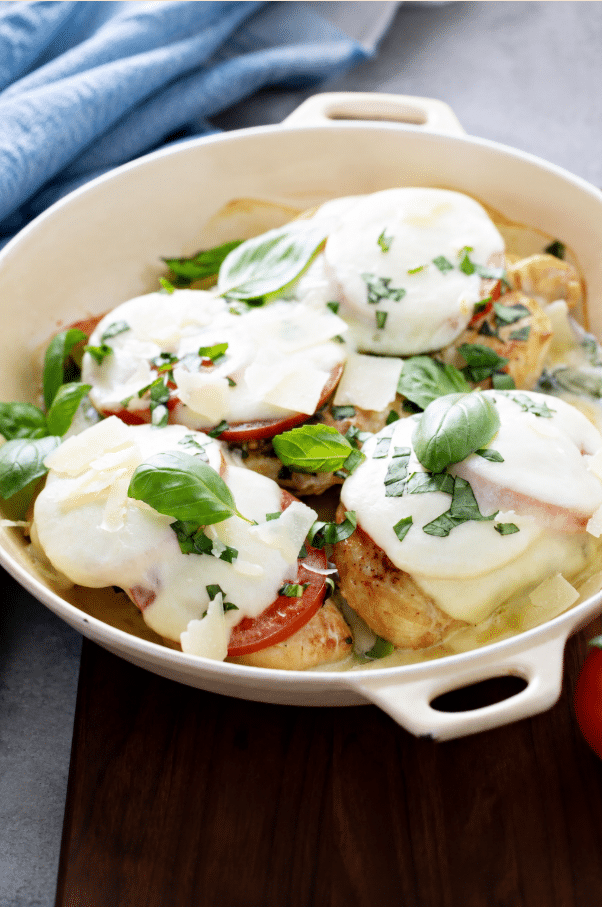Basil Pesto Tomato Mozzarella Chicken Bake served in a pan