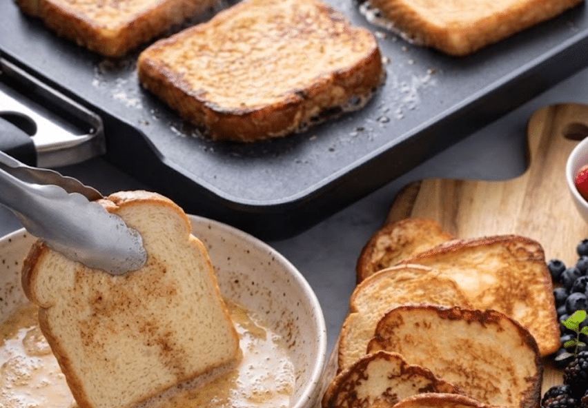 Dipping ang cooking the toast for Easy French Toast Board