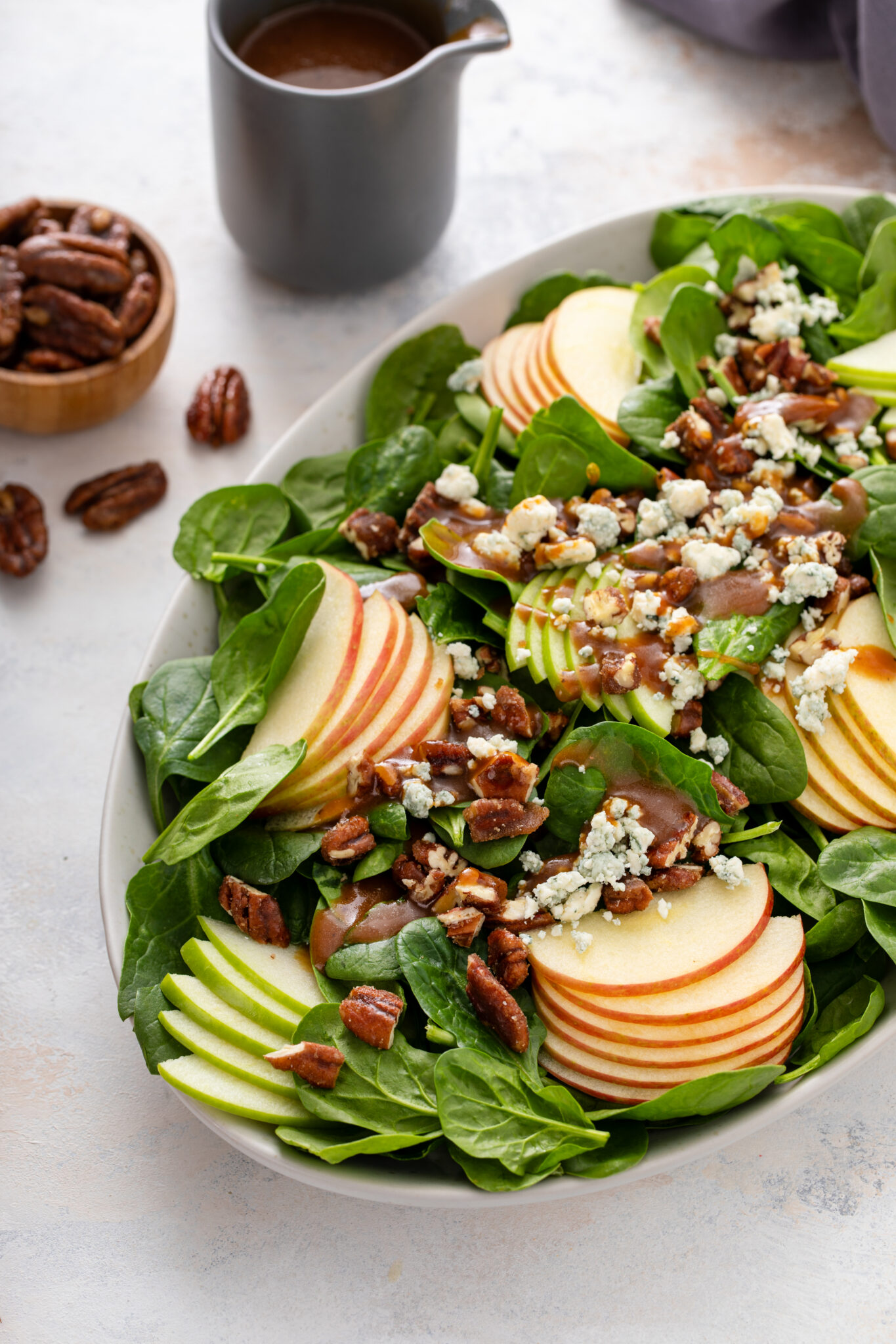 The Perfect Winter Salad served with the store bought dressing, with pecans on the side